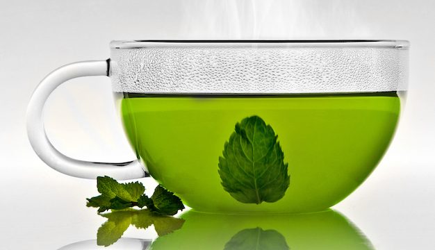 Tee Glas Cup with mint leaf an steam; Shutterstock ID 108614885; purchase_order: -; job: -; client: -; other: -